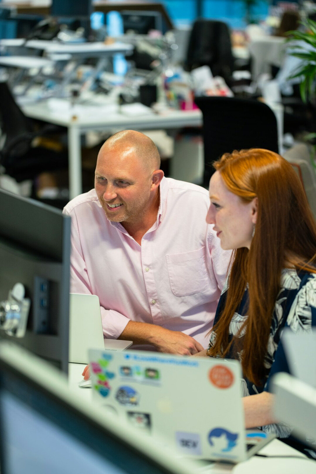 corporate team collaborating on code